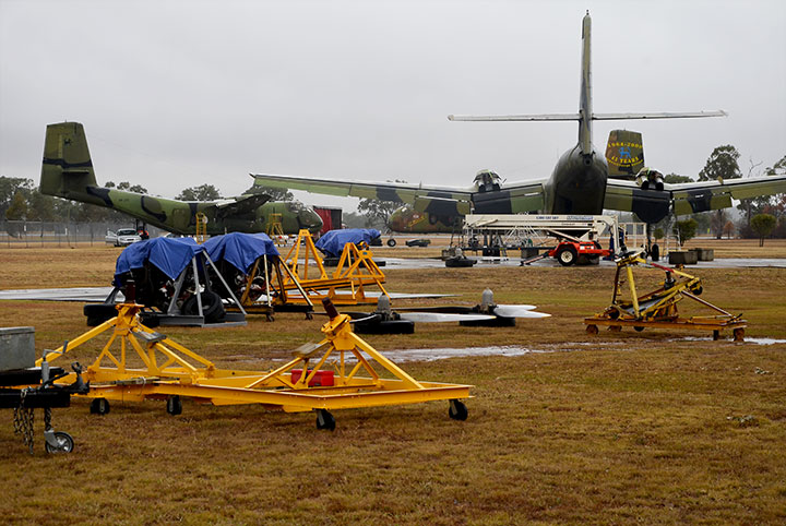 A wet & busy scene dismantling Caribou at Oakey Qld