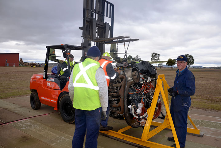 Caribou R2000 engine being placed in stand awaiting transport