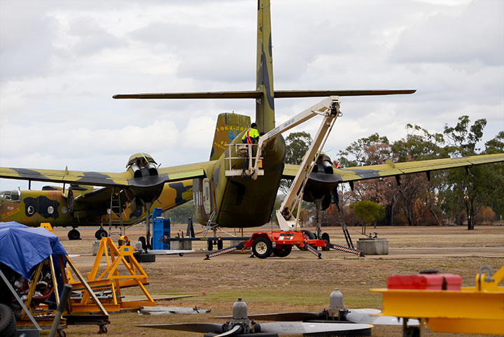 DHC-4 Caribou A4-228- equipment being positioned