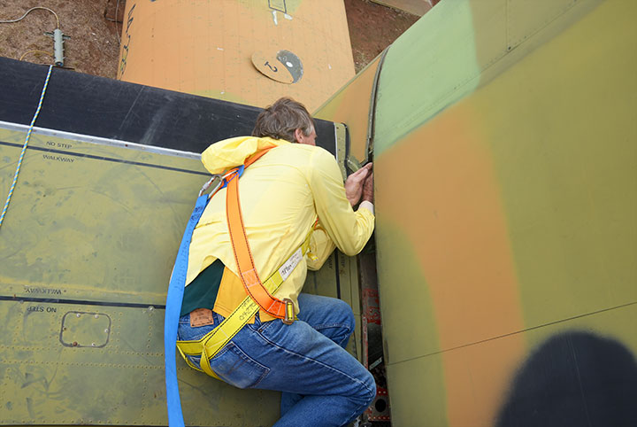 Noel Spalding finishes work to allow removal of A4-228 fin & rudder