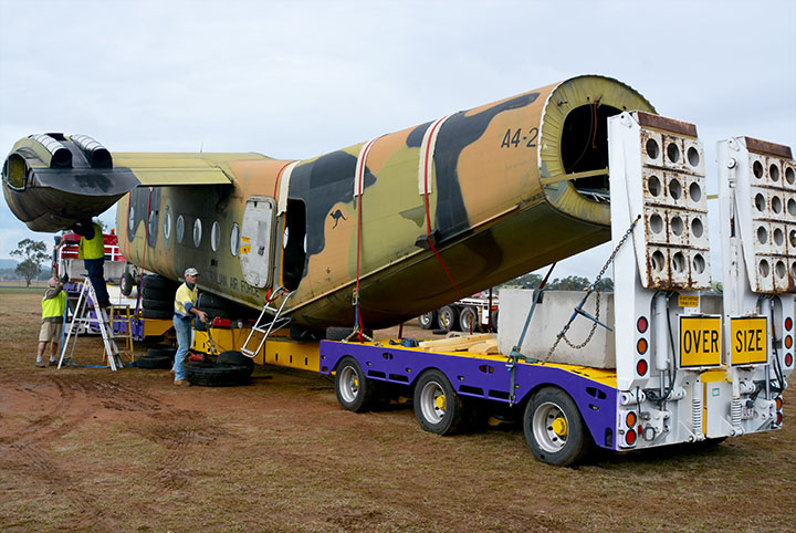 Tying down DHC4 Caribou A4-228 onto Bulldog for her big trip to Caboolture
