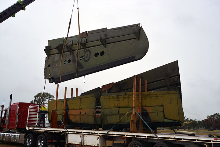 Wing and horizontal stabilizer being loaded
