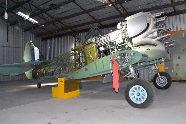 CAC CA-12 A46-54 back on her wheels again awaiting final inspection of the systems before fitting of wooden shell in the background