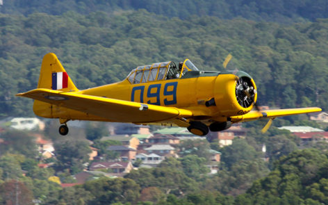 North American T6 Harvard VH-NZX takes off