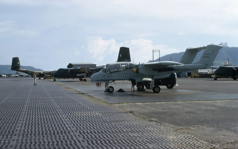 A us air force north american aviation ov 10a bronco aircraft with a red and yellow banded spinner and the tail number 67 14639 on the tarmac at vung tau air base having been unloaded    | warbirds online