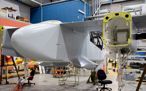 North American Rockwell OV-10A Bronco 67-14639 rear three quarter view of restored fuselage and wing awaiting fitting of tail booms