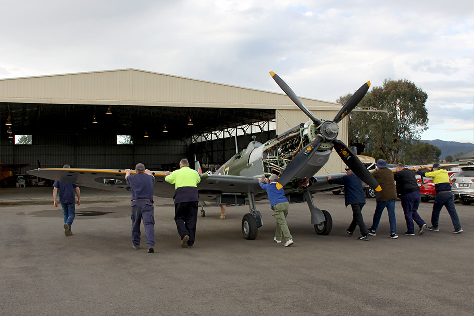 Spitfire MH603 is carefully moved back to the hangar by Pays & VFR staff and HFC volunteers