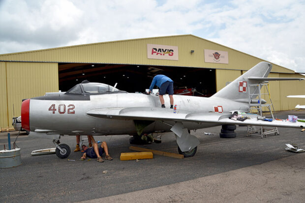 HFC volunteers work on the re-assembly of the MiG-17F at Scone NSW